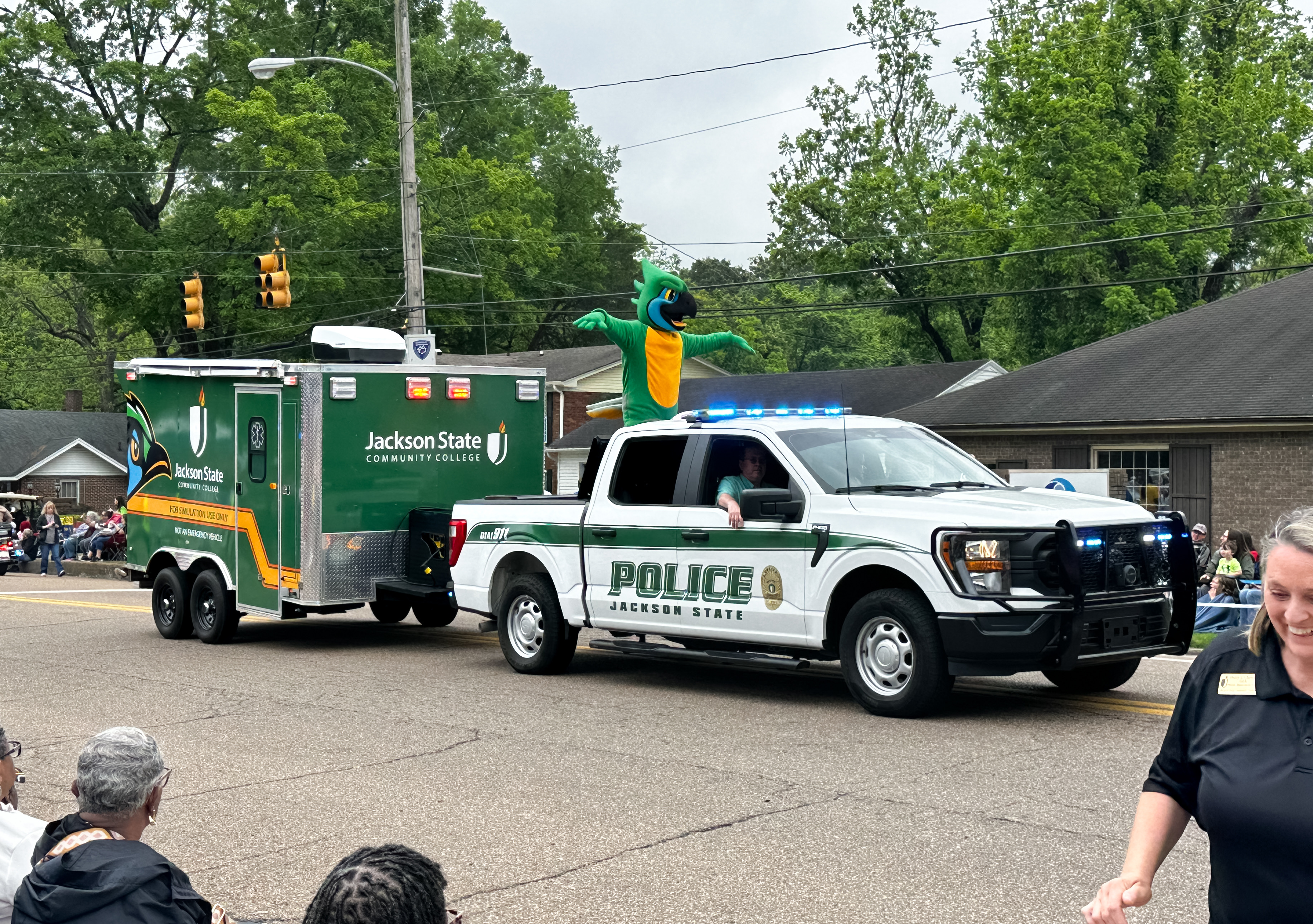 Photo showing the JSCC Police Truck pulling the EMT Ambulance Simulator